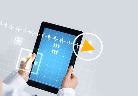 Tablet pc device with medicine interface screen in hands of doctorの写真素材