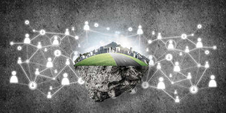 Beautiful small island with grass and cityscape on concrete backgroundの写真素材
