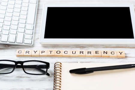 Cryptocurrency concept with letters on cubes. Blockchain technology and digital money. Still life of...