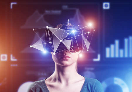 Young attractive woman in VR glasses. Immersion in the virtual world.