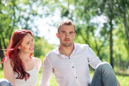 Young couple on a date in the park. Spending time with loved onesの写真素材