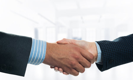 A close-up of a handshake. Making a deal between two businessmenの写真素材