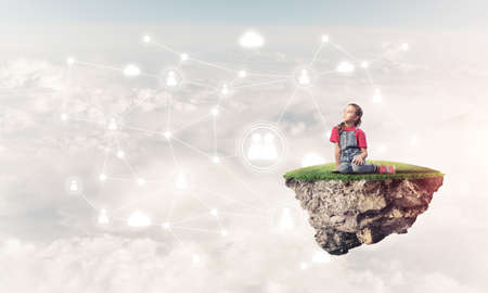Cute smiling girl on floating island presenting social connection conceptの写真素材