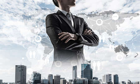 Double exposure of elegant businessman and modern busines city with towers and skyscrapersの写真素材