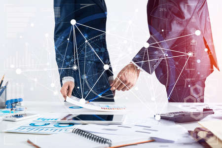 Business partnership concept with business people. Office desk with financial analytics. Business...
