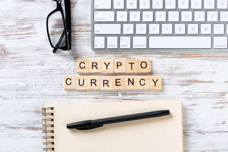 Cryptocurrency concept with letters on cubes. Blockchain technology and digital money. Still life of...