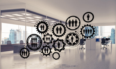 Cogwheels and gears mechanism as social communication concept in office interior. 3D renderingの写真素材