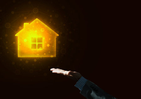 Hand of businessman touching with finger glowing home icon or symbolの写真素材