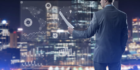 Rear view of businessman against virtual panel interface holding papers in handの写真素材