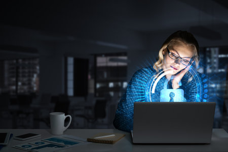 Attractive woman working on laptop and lock icon out of screen. Mixed mediaの写真素材