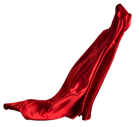 Red cloth flutters in the wind. Isolated on white backgroundの写真素材