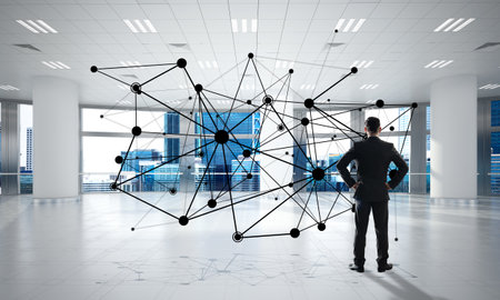 Elegant businessman in modern office interior and social connection concept. Mixed mediaの写真素材