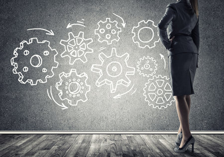 Bottom view of businesswoman and teamwork drawn concept on wallの写真素材
