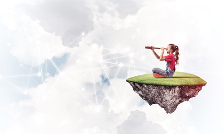 Cute smiling girl on floating island presenting social connection conceptの写真素材