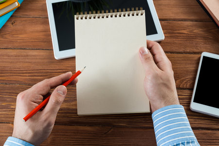 close-up of hands with notepad. office workの写真素材