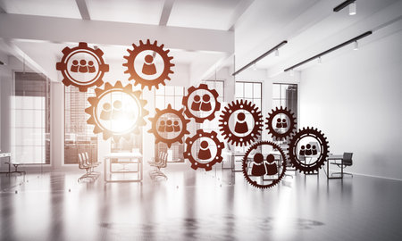 Cogwheels and gears mechanism as social communication concept in office interior. 3D renderingの写真素材