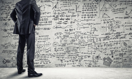 Bottom view of businessman or teacher and sketches at blackboardの写真素材