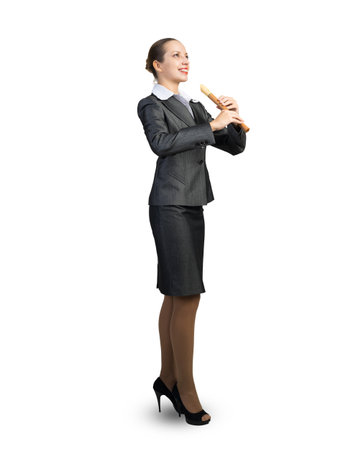 Young woman with a flute in her hands. Inspiration and creativity in business. On a white backgroundの写真素材