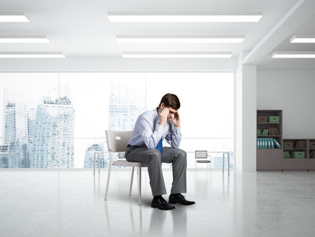 young businessman focused on his thoughts, concentrating on the taskの写真素材