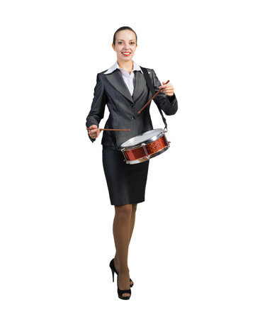 Businesswoman plays the drum. Pace and rhythm in doing business. On a white background.の写真素材