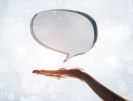 Close of male hand showing shiny glass speech bubble. 3d renderingの写真素材