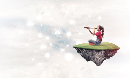 Cute smiling girl on floating island presenting social connection conceptの写真素材