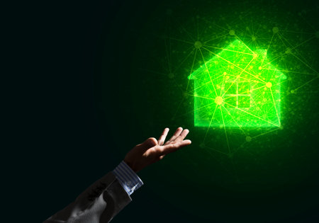 Hand of businessman touching with finger glowing home icon or symbolの写真素材