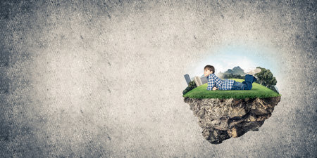 ECO concept floating island and happy kid boy on itの写真素材