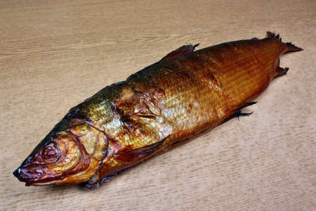 Smoked fish whitefish on the tableの写真素材