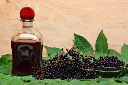 Fruit juice and elderberry on the tableの写真素材