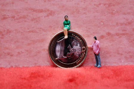 Woman sitting on euro coins