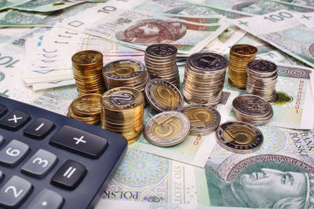 Polish money and calculator on money backgroundの写真素材