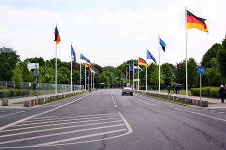 Berlin, Germany - May 18, 2015: The road with flags next to Bundestag (Reichstag) in Berlinのeditorial素材