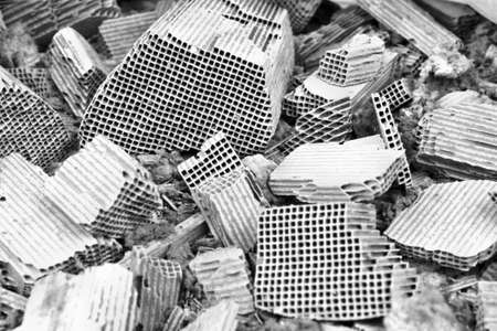 Pices of broken catalytic converter. Pieces part of car catalytic converter having platinum, rhodium, palladiumの写真素材