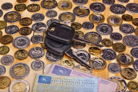 Documents car keys and money coin on the tableの写真素材