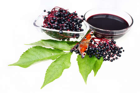 Fruit juice elderberry and butterfly on white isolated background