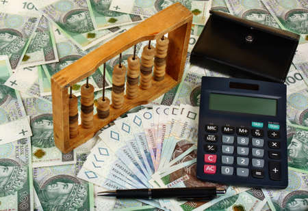 Polish money, calculator, pen, wallet and abacusの写真素材
