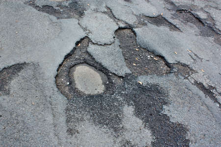 Large hole in the asphalt pavement gapの写真素材