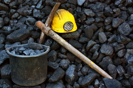 Mining tools on a background of coal
