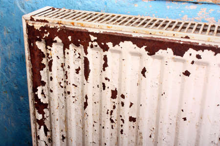 Rusty, destroyed, devastated, moldy radiator central heating at homeの写真素材