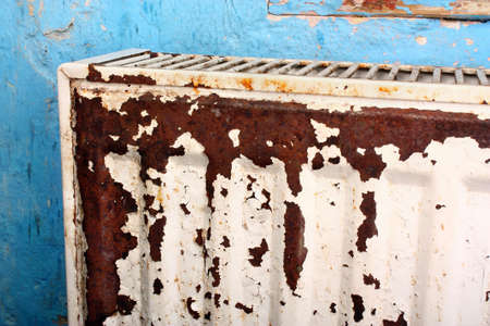 Rusty, destroyed, devastated, moldy radiator central heating at homeの写真素材