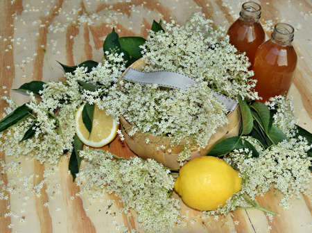Health drink from elderberry flowers on a wooden tableの写真素材
