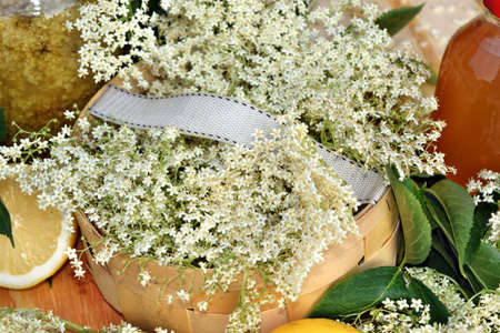 Health elderberry flowers on a wooden table