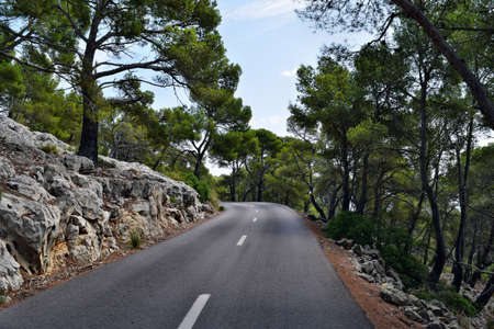 Open coastal road winding through to lighthouse Cap Formentor, Mallorca, Spainの写真素材