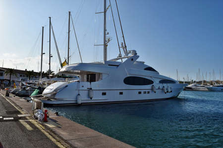 Port d'Alcudia, Mallorca, Spain - August 26, 2018: Promenade along marina. Port d'Alcudia is a...