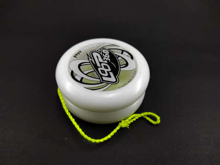 Cikanciung, West Java, Indonesia - May 3, 2022 :White yoyo from yoyo factory brand isolated on black background, Not Focusのeditorial素材