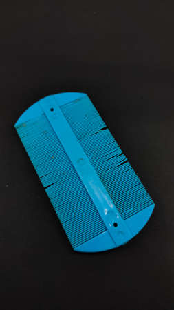 Blue dirty comb isolated on black background, Not Focusの写真素材