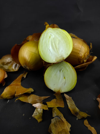 Abstract Defocused Blurred Background Photo of a pile of onions, isolated on a black background in the Cikancung area - Indonesia. Not Focusの写真素材