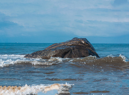 Rock in the sea with waves and blue sky, Kribi, Cameroonの写真素材
