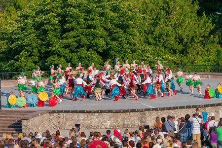 KIEV, UKRAINE - July 22 , 2016: Ukraina School of Dance Ensemble girls and boys dressed in traditional red Ukrainian embroidered costume clothes dancingのeditorial素材